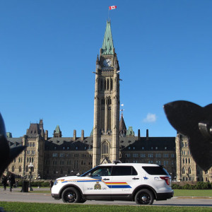 Photograph of Canadian Parliament Hill with RCMP police car (Source of photo - Sheldon Boles)